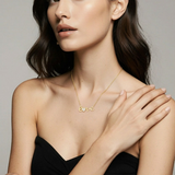 14k solid gold script necklace with love heart sentiment worn by a woman by Qutahia Jewelry