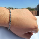 Chunky silver bracelet featuring 4.5mm floral links by Qutahia Jewellery.
