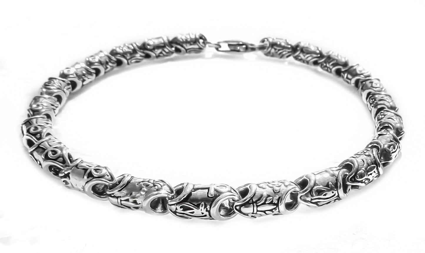 Chunky silver bracelet featuring Ankh and floral links by Qutahia Jewellery.