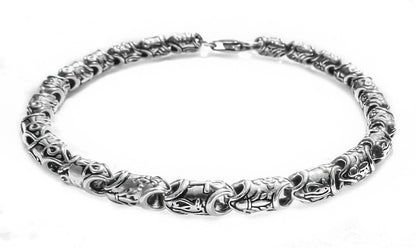 Chunky silver bracelet featuring Ankh and floral links by Qutahia Jewellery.