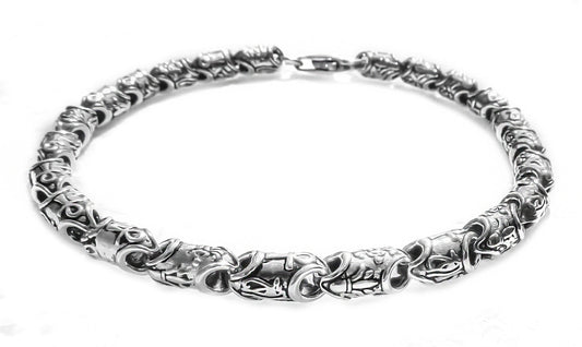 Chunky silver bracelet featuring Ankh and floral links by Qutahia Jewellery.