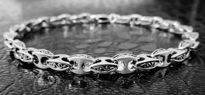 Detailed close-up of an oxidized gents silver bracelet by Qutahia Jewellery.