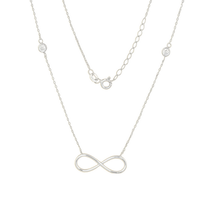 Qutahia Jewelry 14k yellow gold infinity necklace with bezel-set clear zircon and delicate chain.